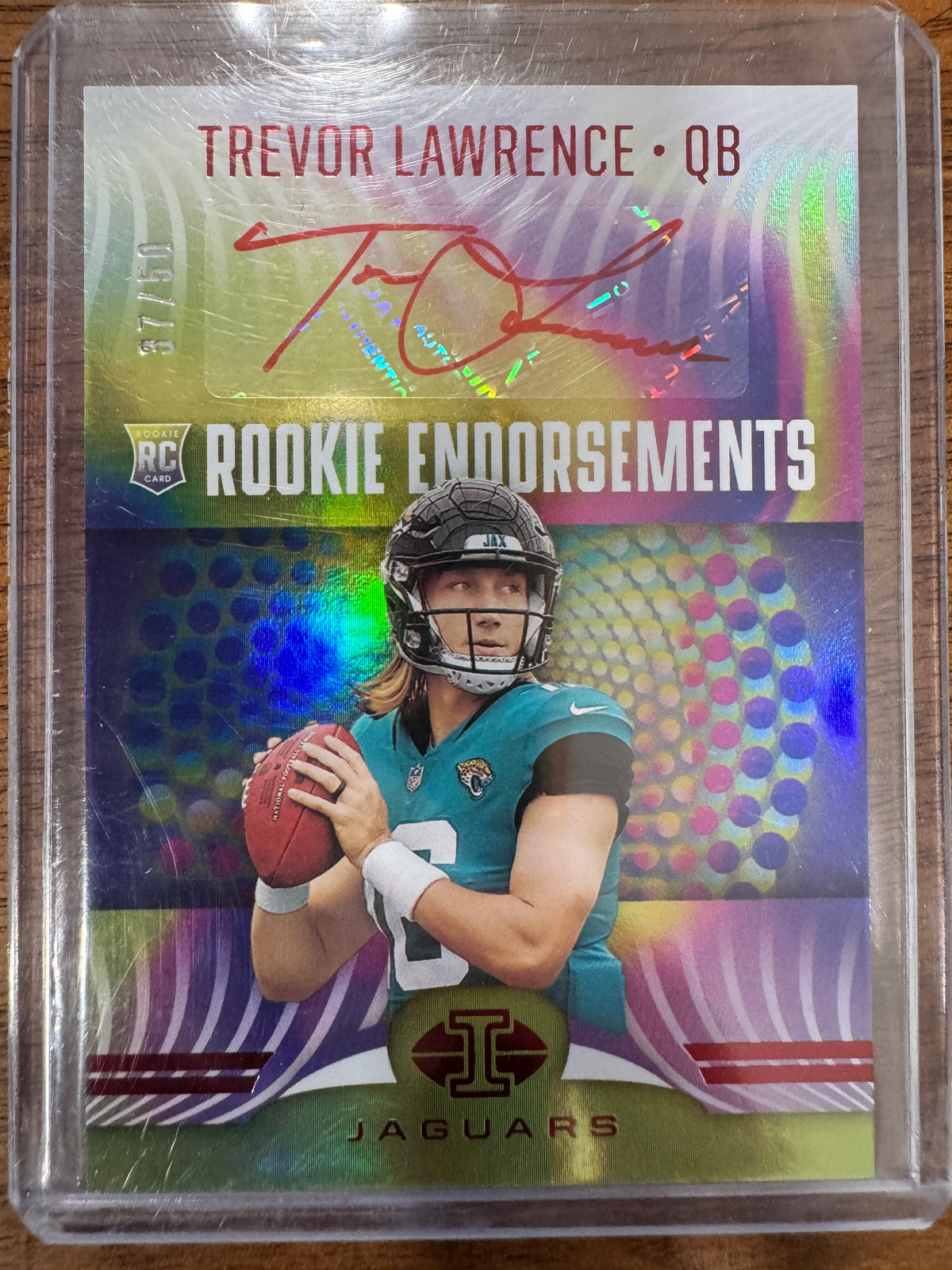 2021 Panini Illusions - Rookie Endorsements Trevor Lawrence #RE-1 Red /50